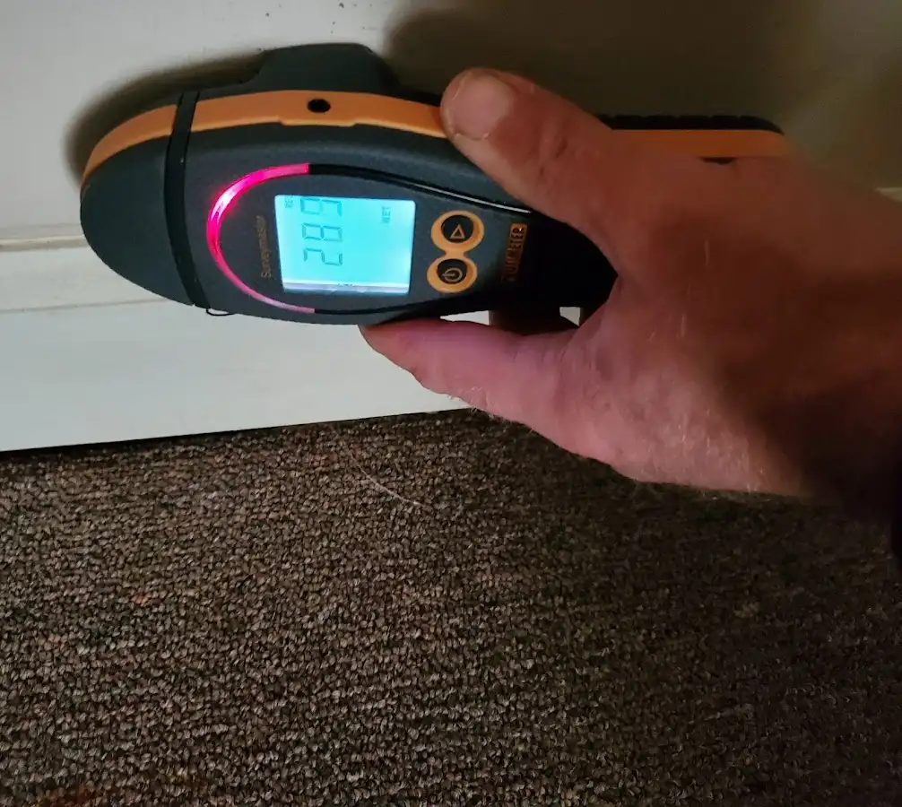 Moisture detection at baseboard during Storm Damage Restoration in Danvers